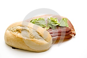 Roll with ham and salad leaf