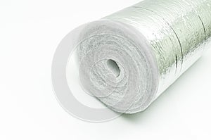 A roll of insulation made of foamed polyethylene with aluminum foil. Thermal insulation with reflective foil. Selective