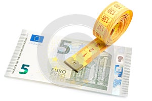 Roll of measuring tape on new five euro banknote photo