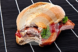 Roll with meat loaf and fried egg