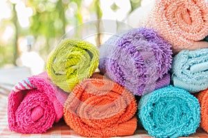 Roll of Multicolour towels on table cloth