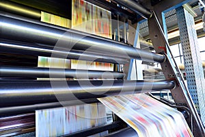 Roll offset print machine in a large print shop for production o