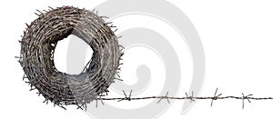 A roll of old barbed wire stretched