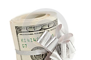 Roll of One Hundred Dollar Bills With Silver Bow on White
