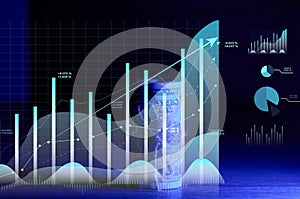 Roll of one hundred dollar bills tied with a rope and a graph with rising rates. Income growth concept, high margin