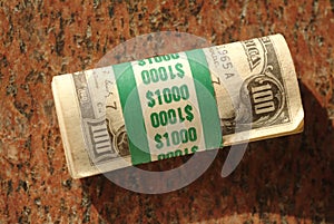 Roll of $ One Hundred dollar bills totalling $10