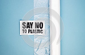 A roll of plastic bag marked say no to plastic