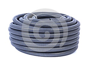 Roll of plastic corrugated pipe for electrical installation isolated on white