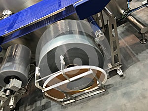 Roll of plastic packaging film on machine