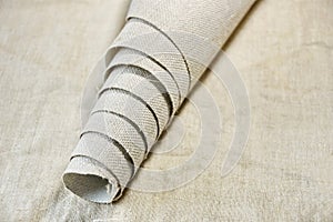 Roll of primed canvas on linen light canvas photo