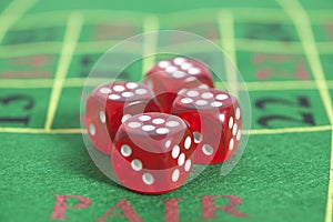 Roll of the red dice on game table