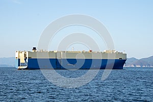 Roll-on/roll-off RORO or ro-ro ships or oceangoing vehicle carrier ship anchor in the open sea