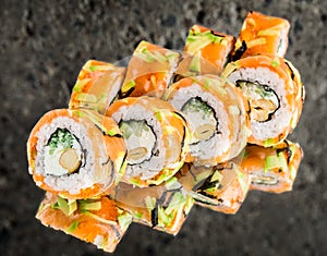 Roll with salmon, svocado, cucumber and nuts