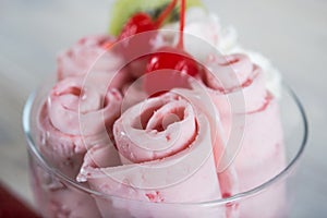 Roll of Strawberry ice cream. Fresh fried berry ice cream, ice