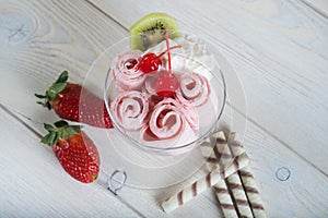 Roll of Strawberry ice cream. Fresh fried berry ice cream, ice