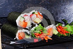 Roll sushi black background different tastes, crab, carrots, lettuce, tofu, salmon, still life, home, stylish, wooden