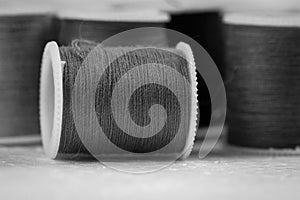 The roll of thread on background,needlework,craft,sewing and tailoring concept,art style,black and white tone