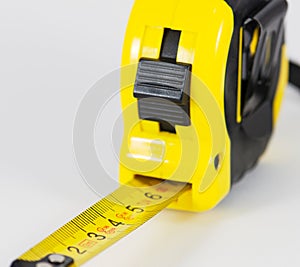 Roll-up tape measure on a white background
