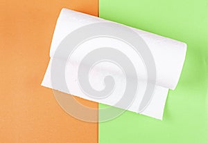 Roll of white paper on a colored background