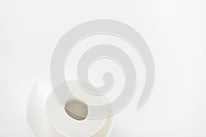 Roll of white toilet paper on white background