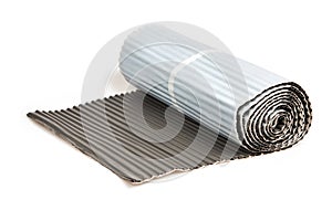 Roll of wide metal adhesive tape for roof joint isolated