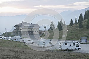 PASSO ROLLE, DOLOMITES, ITALY, 26 SEPTEMBER, 2021: Campers in the parking of Hotel Venetia in Passo Rolle, Dolomites.