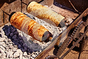 Rolled bakery meat rolls in charcoal