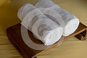 Rolled bath towels at hotel spa