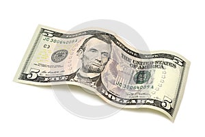Rolled bill of five dollars
