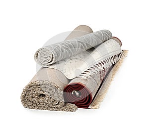 Rolled carpets on white background. Interior element