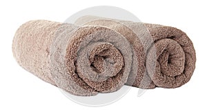 Rolled clean brown towels on background