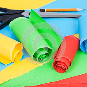 Rolled color paper on sheets of plain paper