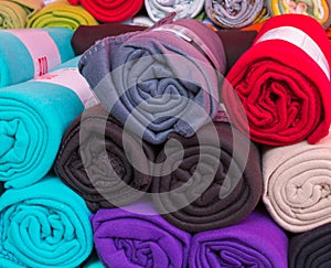 Rolled colorful fleece blankets