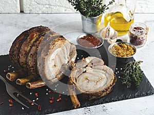 Rolled cut roast beef Rump, pork, lamb, in red marinate, meat roll, spices wooden background