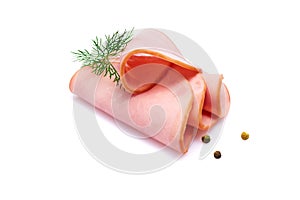 Rolled ham slices isolated on white background with herbs and spices