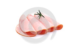 Rolled ham slices isolated on white background with herbs and spices