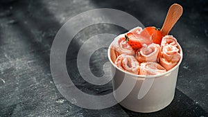 Rolled ice cream in cone cup on dark,copy space