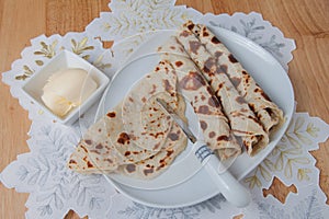 Rolled lefse served on a plate