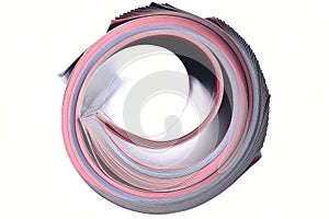 Rolled magazine isolated on white