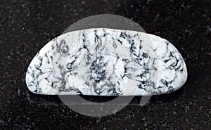 rolled Magnesite rock on black