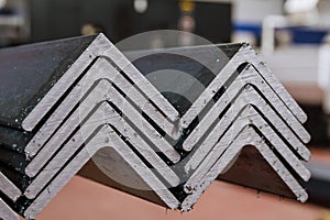 Rolled metal, L-profil. Stack of angle steel in the factory