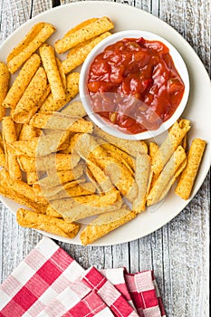 Rolled mexican nacho chips and salsa dip