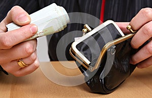 Rolled money in hands