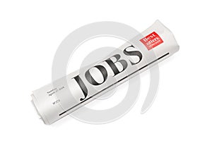 Rolled newspaper with headline JOBS on white background