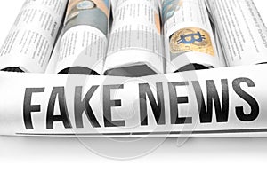 Rolled newspapers on white background