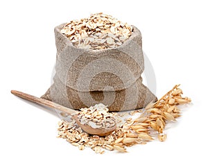 Rolled oats in a bag isolated on white background photo