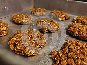 Rolled oats cookies on baking tray to put into the oven