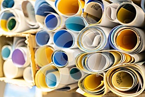Rolled Poster Paper Stack With Color Print Design Background