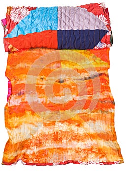 Rolled silk batik and patchwork scarf isolated