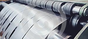 Rolled steel. Stack of rolls, cold rolled steel coils in action